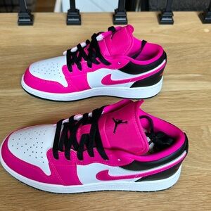 Brand new Nike kids pink & black Air Jordan 1 low dunks. Size 4Y.